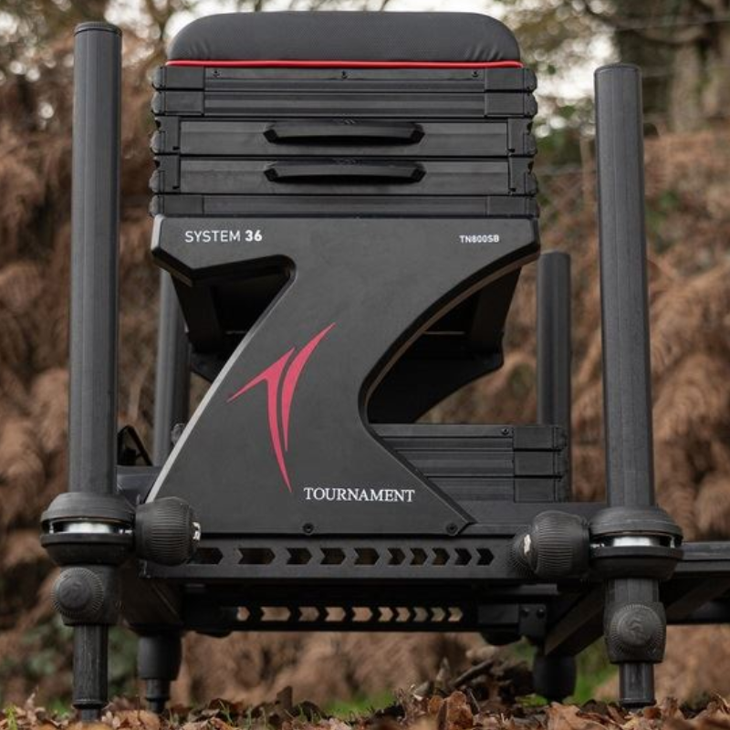 Side view photo of the Diawa fishing seat box. The box is black and red.