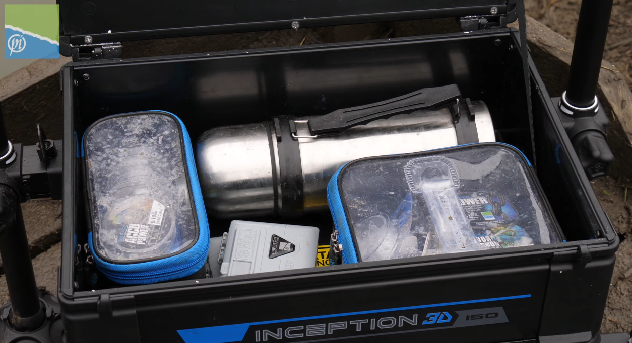 Photo of the 15cm base until on the Preston Innovations 3D 150 Seat Box filled with a flask, maggot containers and other fishing tackle